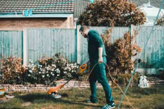 man mowing the yard